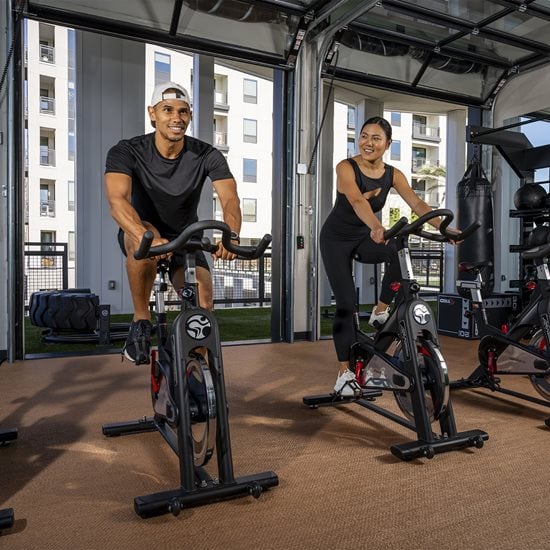 Woman and man in fitness center